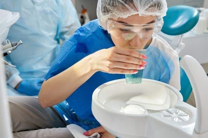 at dentist using mouth wash